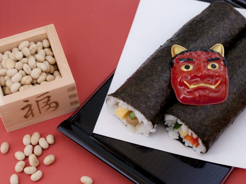 節分の豆まきと恵方巻きのイメージ